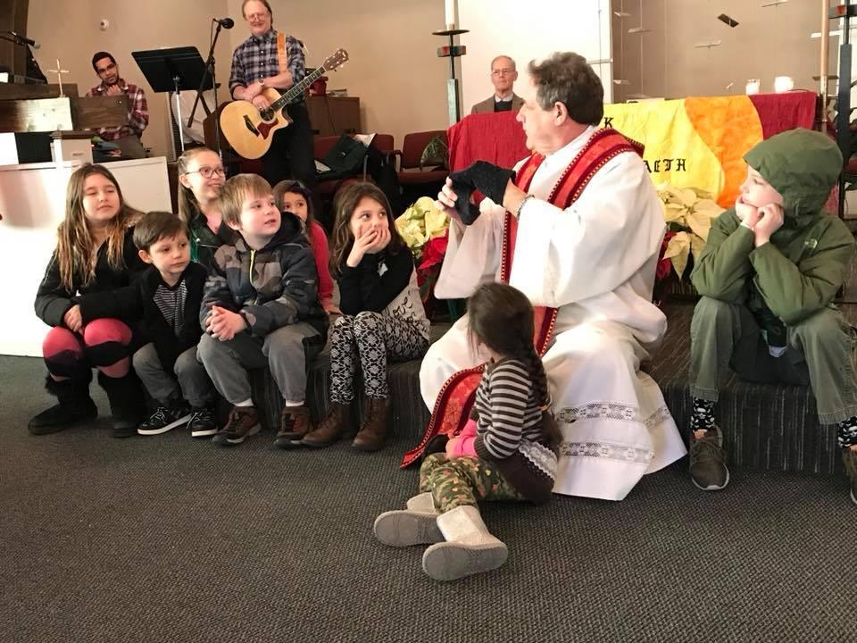Children gathered together at the front of the sanctuary